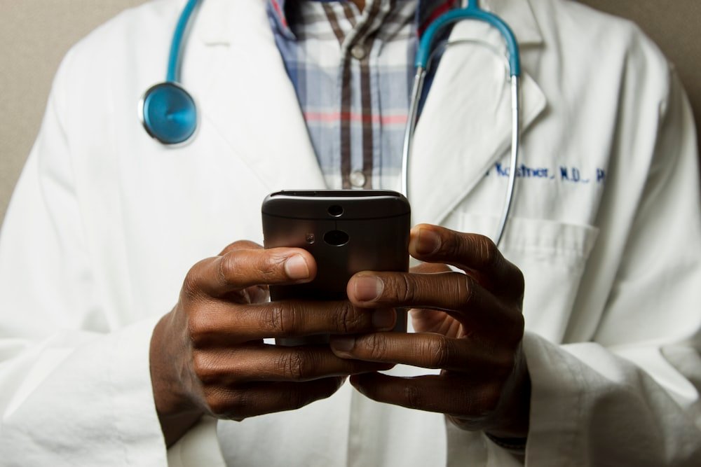 Healthcare professional visiting a patient at home for a medical consultation